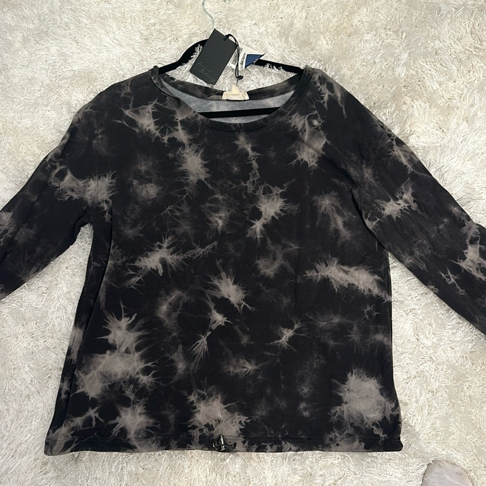 This sweatshirt it is like a black tie-dye sweatshirt.